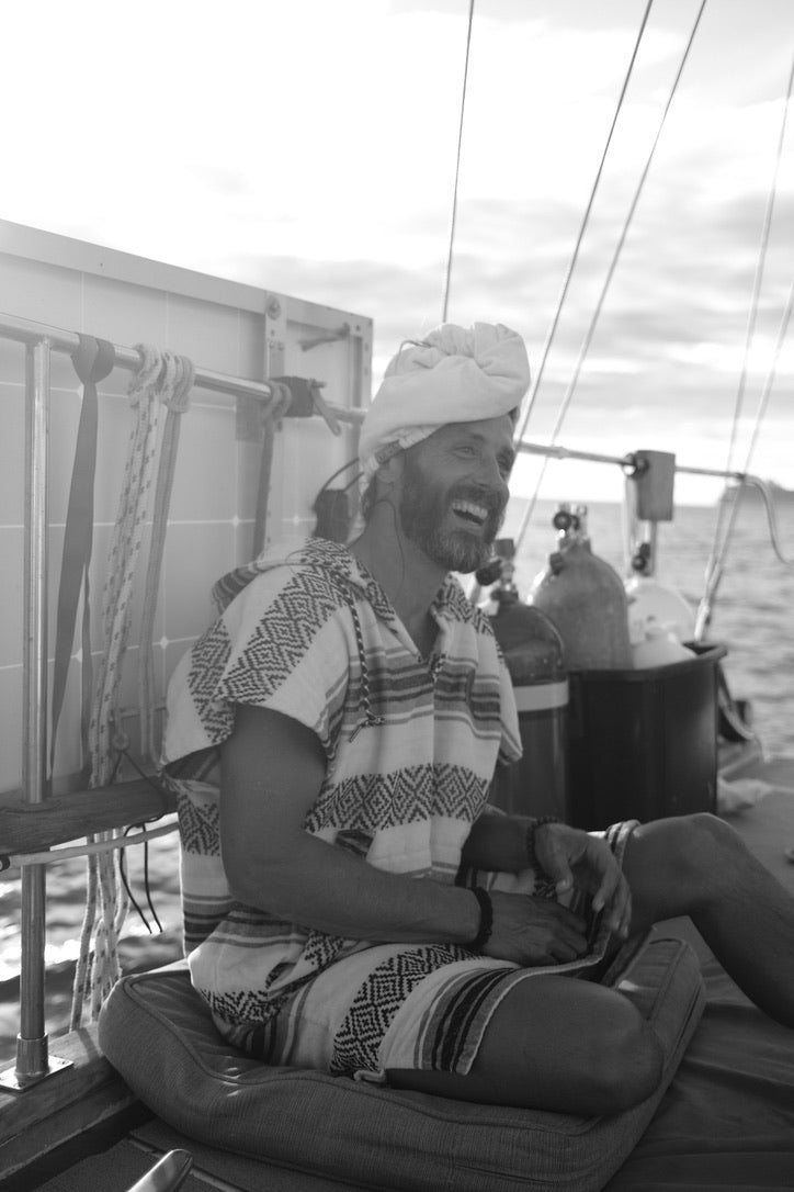 Mike Gingerich, founder of Neurvana Ohana, laughing aboard a sailboat